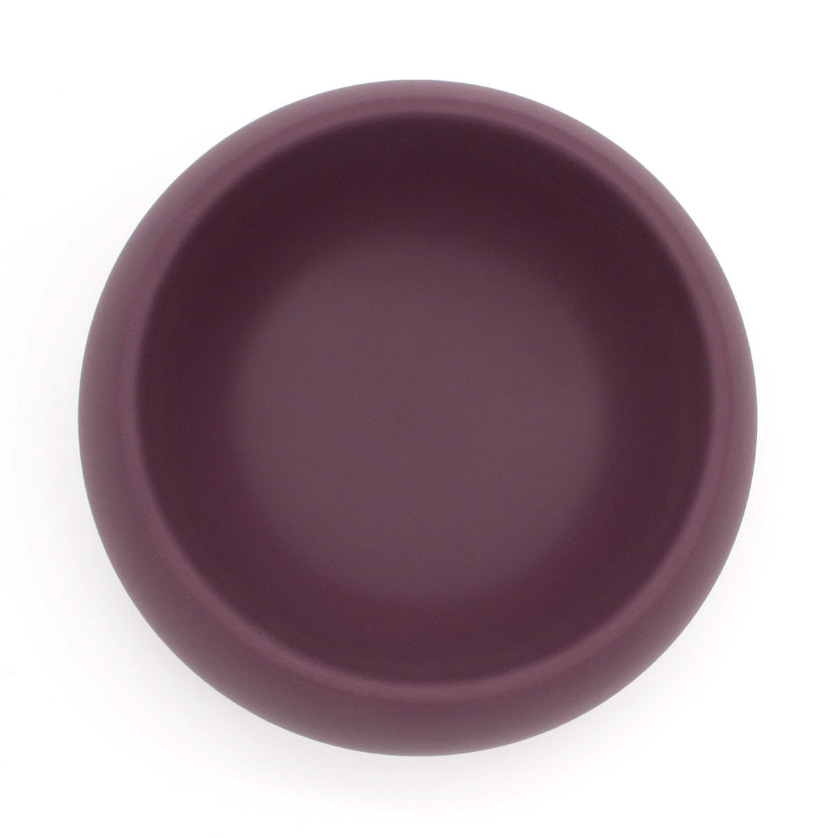 A top-down view of houndstone coquito silicone dog food bowl in plum