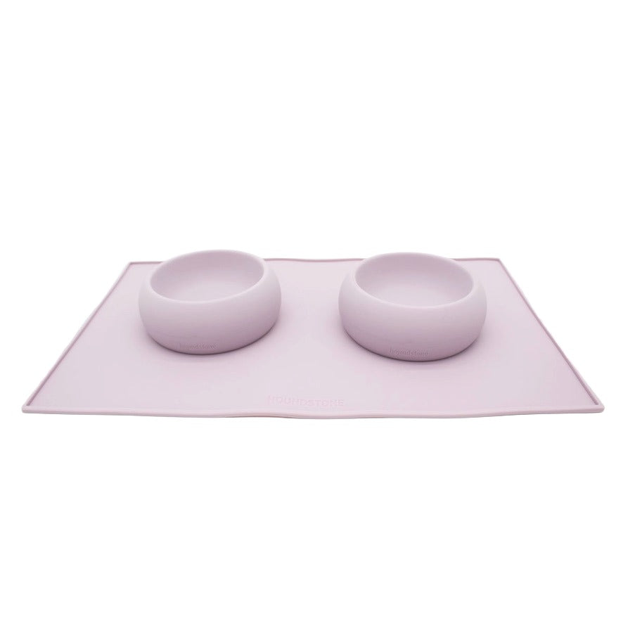 2 mauve Houndstone dog bowls on a dog food mat on a white background