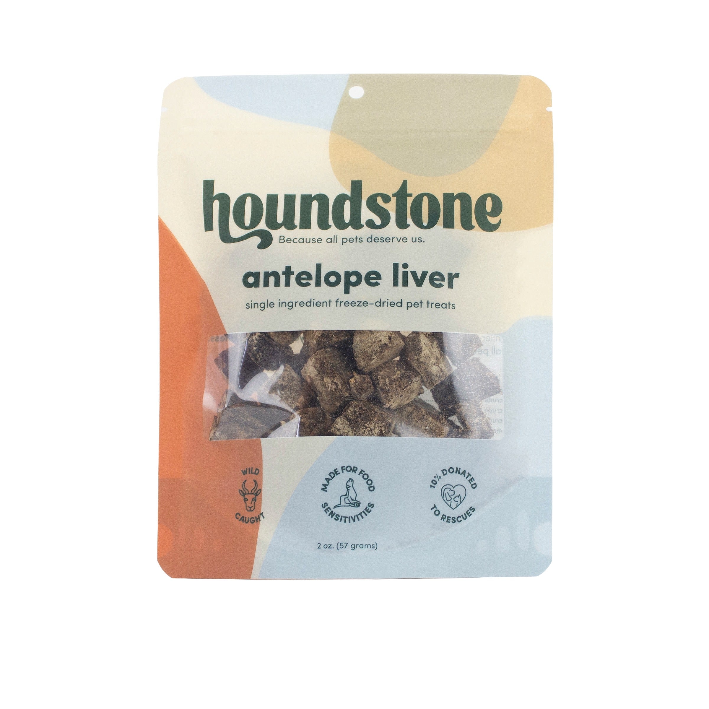A 2 oz bag of Houndstone Antelope Liver single ingredient freeze-dried cat treats. The packaging features a modern abstract design with beige, orange, and light blue shapes, and a clear window showing the dark brown freeze-dried cat treats inside.