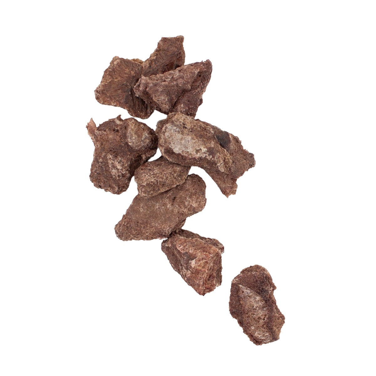 several pieces of Houndstone freeze dried cat treats scattered on a white background.