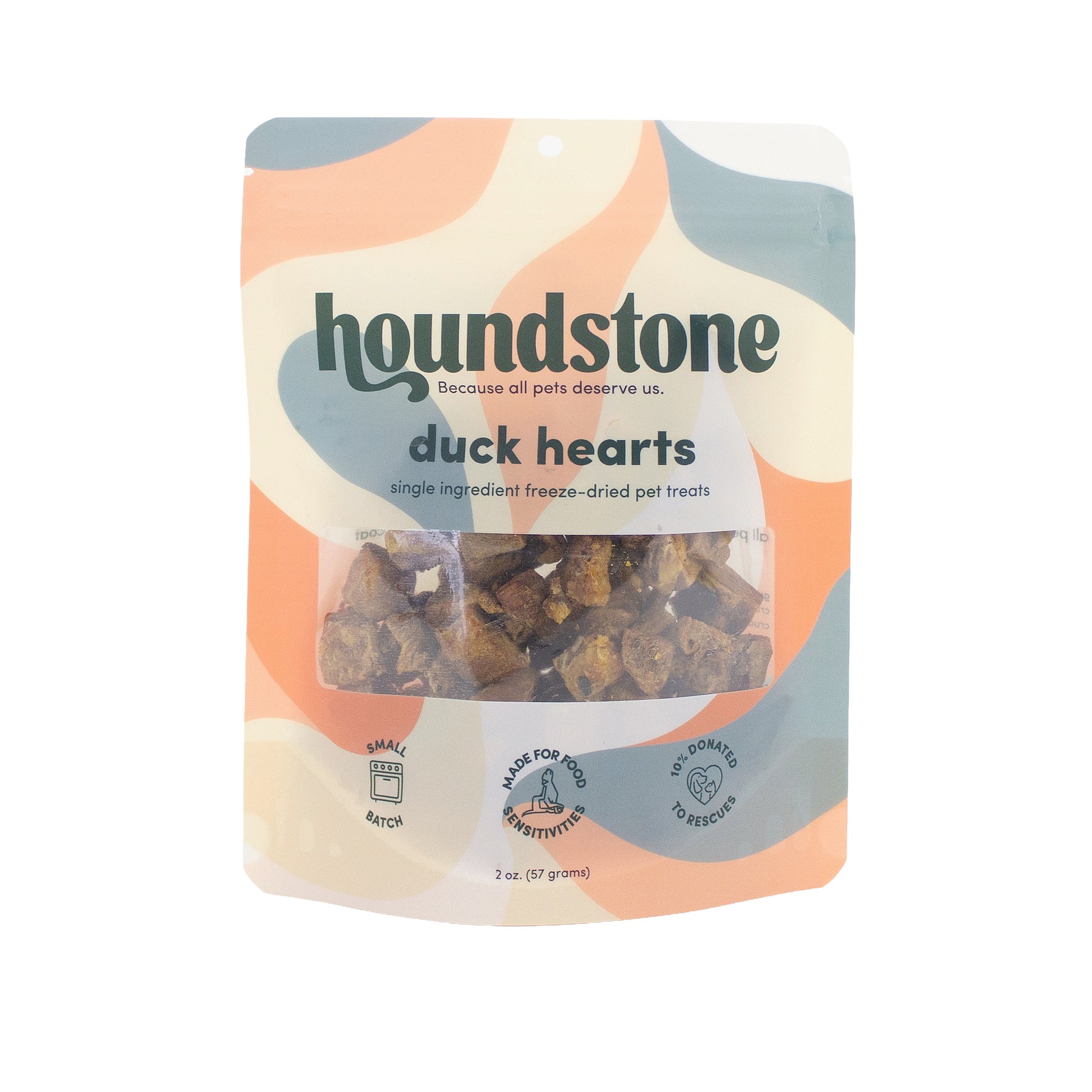 A 2 oz pouch of Houndstone Duck Hearts freeze-dried cat treats, featuring a retro wavy pattern in orange, beige, and blue-gray, with a clear window showing the treats inside.