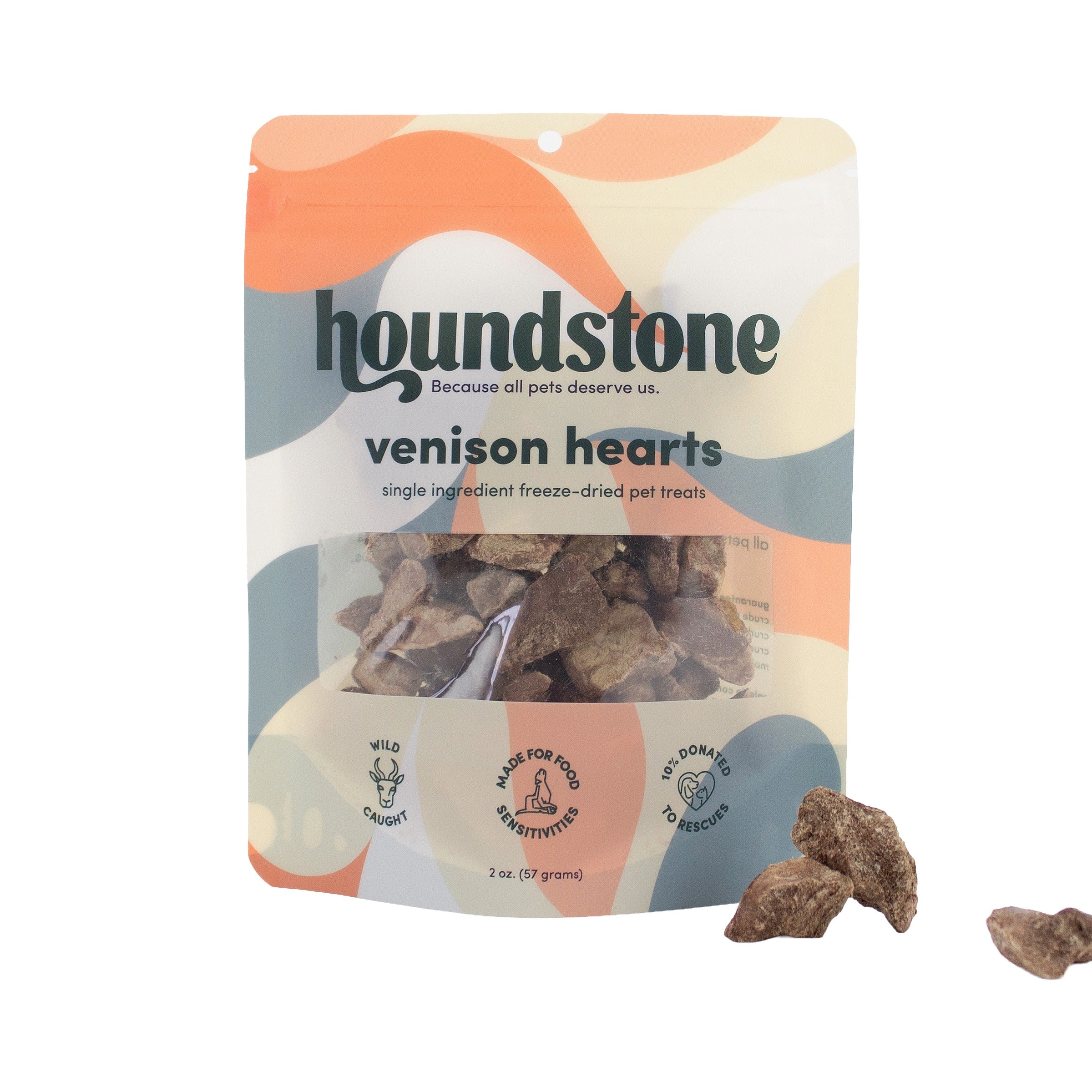 A package of Houndstone Venison Hearts freeze-dried cat treats on a white background, with three treats displayed outside the package to the right.