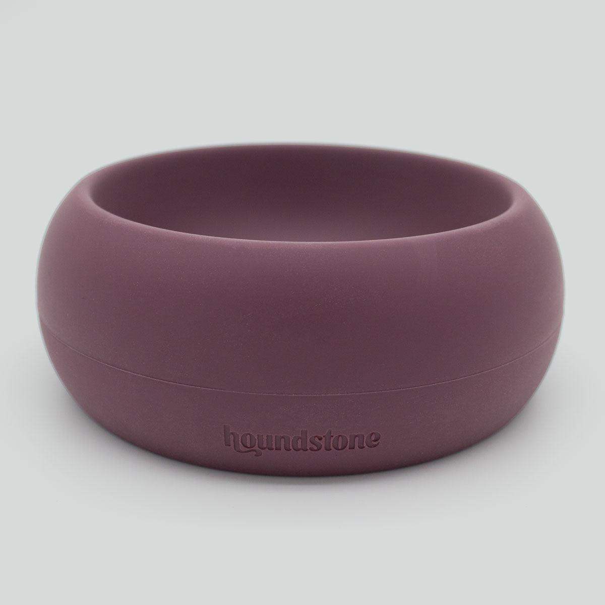 Purple dog bowl with 'houndstone' branding on a light gray background