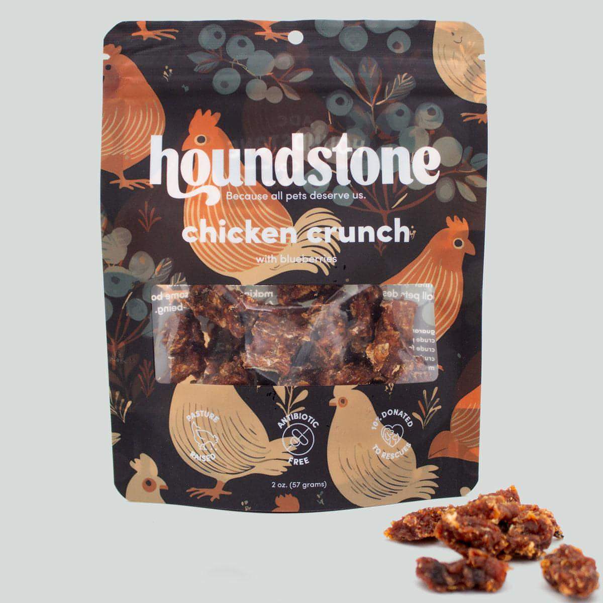 Houndstone chicken crunch dehydrated dog treats package with chicken illustrations on a dark background
