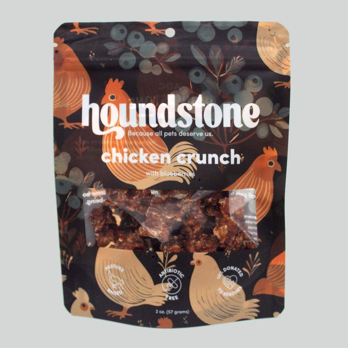 Houndstone chicken crunch dehydrated dog treats package with chicken illustrations on a dark background